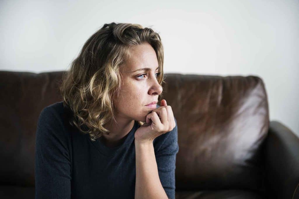 Depressed woman thinking about treatment